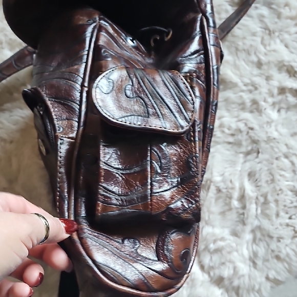 Elegant Brown Leather Backpack with Embossed Design - Picture 5 of 14
